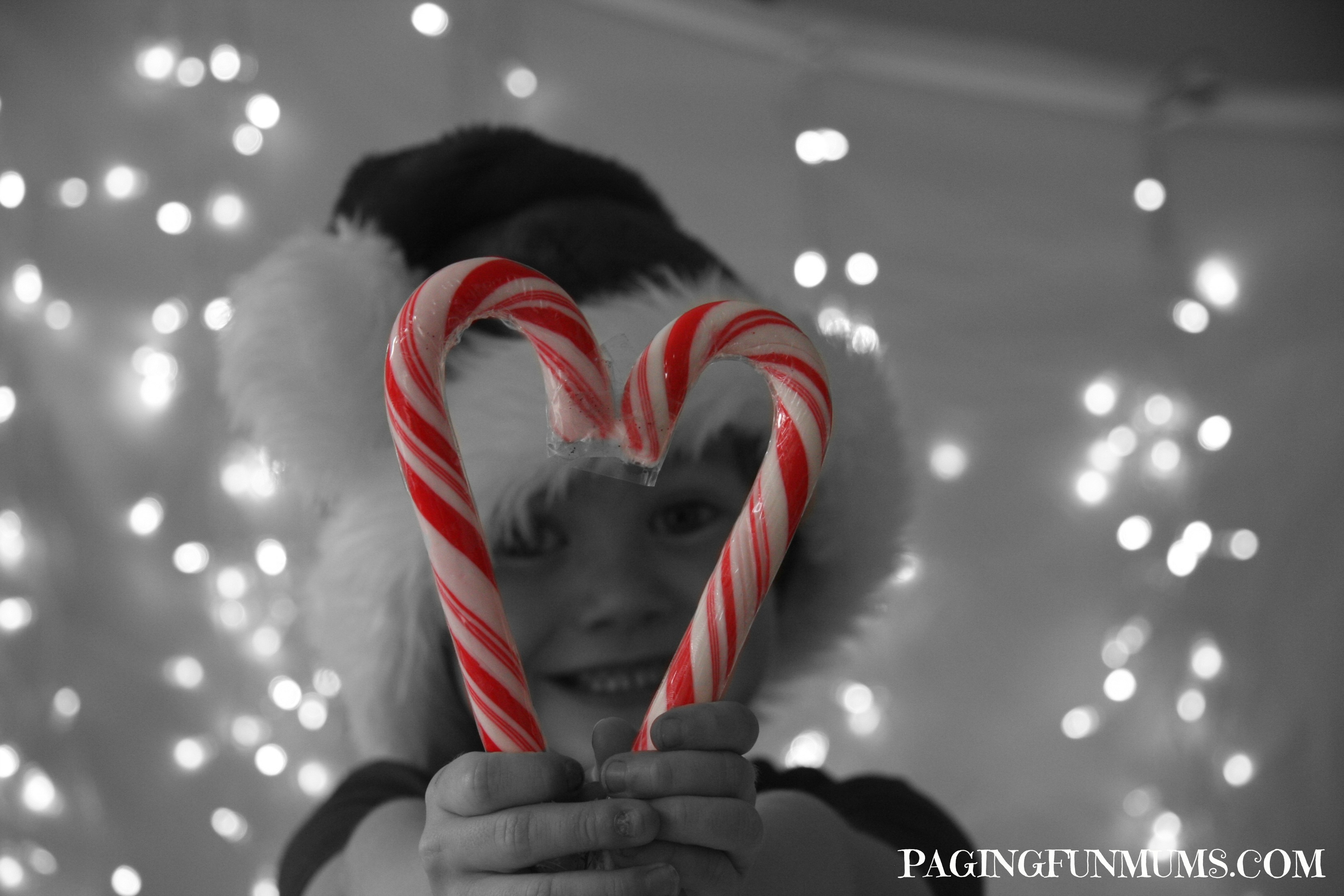 Fun Christmas Photos with Kids - Two Candy Canes make a great prop!