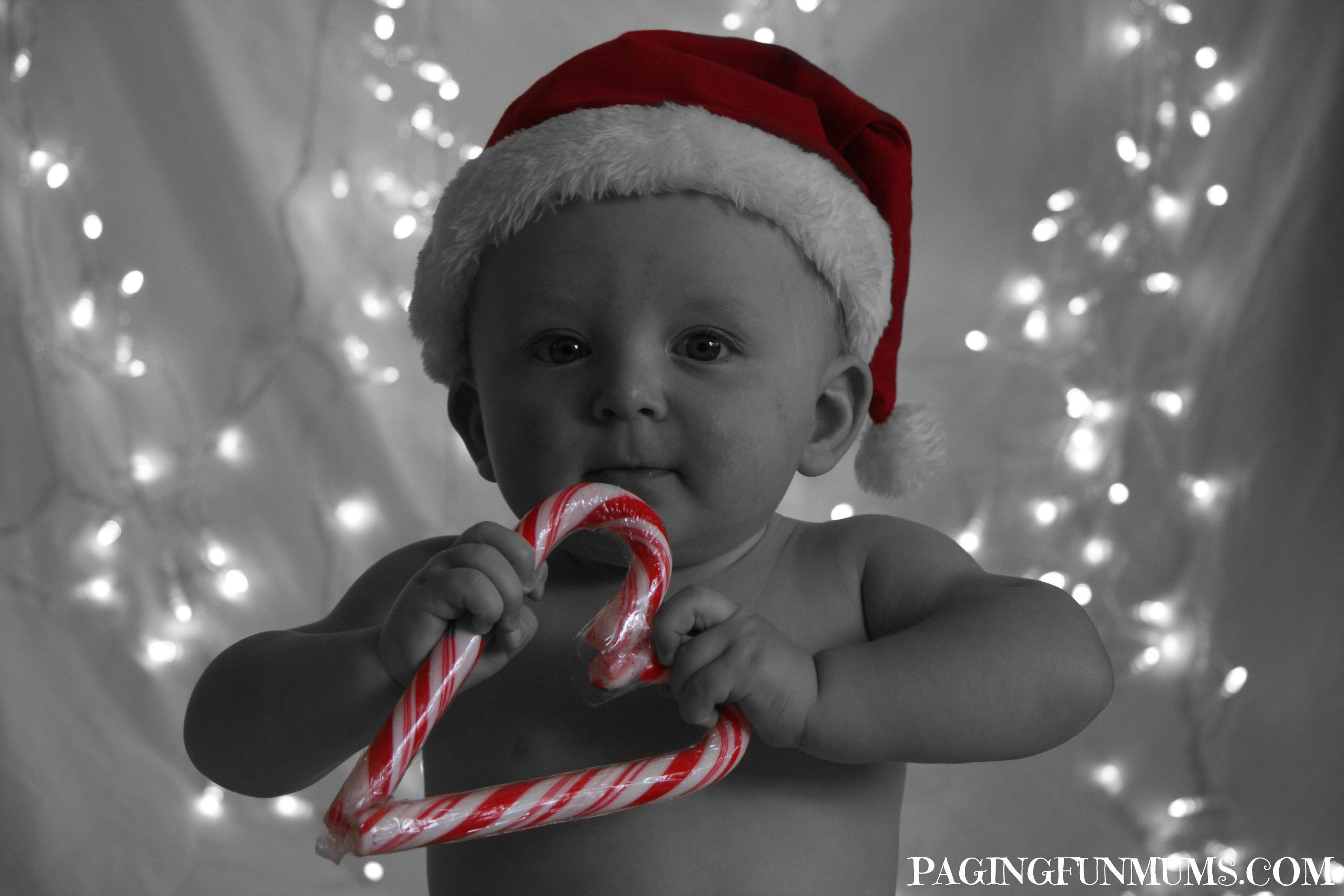 Fun Christmas Photos with Kids - Two Candy Canes make a great prop!